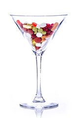 pills in a cocktail glass