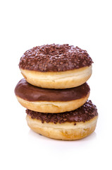 stack of three chocolate donuts