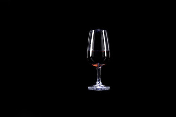 Red wine glass on black