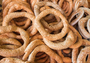 Background of fresh sesame bagels for sale at local farmers market