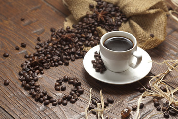 White cup of coffee with beans