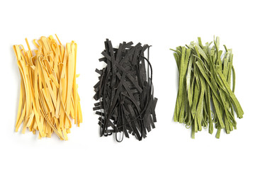 three varieties of tagliatelle pasta, classic, spinach and cuttlefish