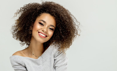 Beautiful black woman sitting and smiling