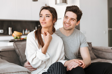 Portrait of a smiling young couple relaxing together
