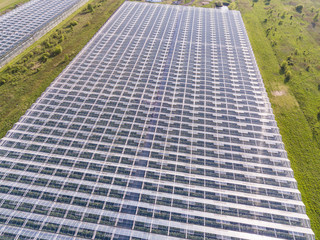 Aerial view of glass greenhouses in the fields of Poland 