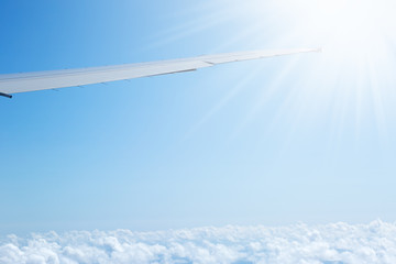 Aerial view from plane on wing and clouds