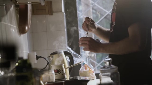 Man Pouring Steaming Fresh Made Coffee In A Coffee Cup 1