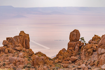 Fototapeta na wymiar Blick aus dem Tirasgebirge auf die Strasse C 13 am Rande der Namib, Karas, Namibia
