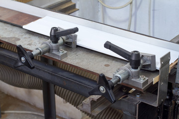 Press bonding. Metal glue press for wood frame on fixed table.