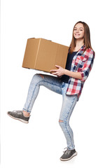 Delivery, relocation and unpacking. Smiling young female carrying cardboard box in full length, isolated on white background
