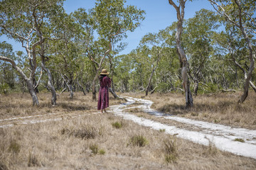 Woman taking photo of Beautiful nature of landscape with forest in summer of Phra Thong Island,Phang Nga Province, Thailand.