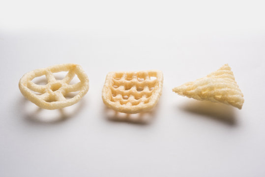 Fototapeta Indian crunchy fryums or papad snack in wheel, square and triangle shape. selective focus  