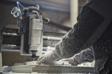 Man operating cnc machine