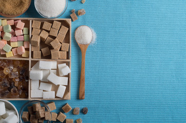 different types of sugar on the blue tablecloth