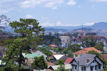 Fototapeta na wymiar Top view Dalat city with bluesky and clouds in the hill, Dalat Vietnam. Vacation, holiday concept.