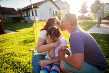 Modern professional scientist sitting at the table with towel and flask at cosmetic fabric laboratory.