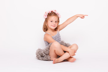 Kid three years old girl pointing the finger