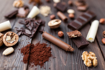 Delicious chocolate on wooden background