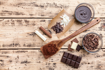 Delicious chocolate on wooden background