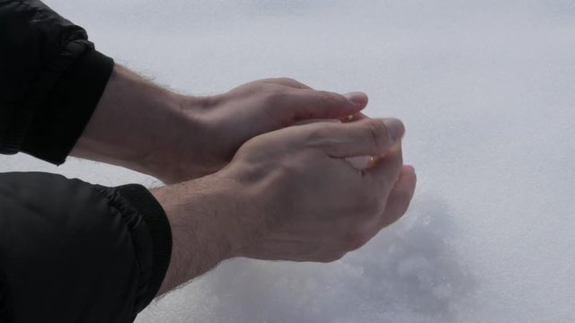 Snowball made for playing and fighting footage - Wet snow shaping by hands