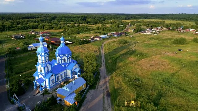 The village church is white and blue. Aerial photography