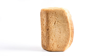 A loaf of white bread on a light background.