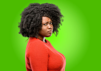 Beautiful african woman irritated and angry expressing negative emotion, annoyed with someone