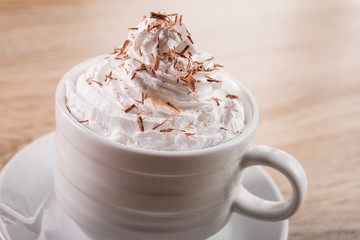 Tasty coffee cup frappe with cream
