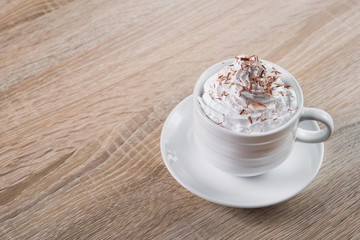 Tasty coffee cup frappe with cream