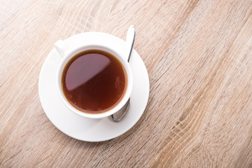 Hot tea cup with spoon