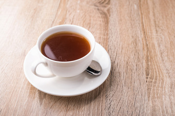 Hot tea cup with spoon