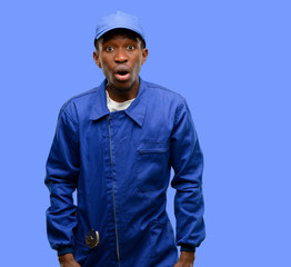 African black plumber man scared in shock, expressing panic and fear
