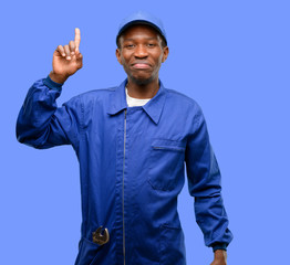 African black plumber man raising finger, the number one
