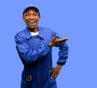African black plumber man holding something in empty hand