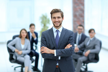 Successful businessman at the office leading a group