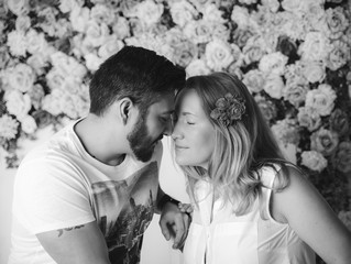 Emotional romantic hipster couple.People in love.Flowers background.Black and white