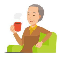 An elderly man wearing brown clothes is sitting on a sofa and drinking coffee