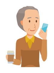 An elderly man wearing brown clothes has coffee and manipulating a smartphone