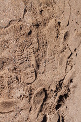 Fototapeta na wymiar footprints in the sand, abstraction, background
