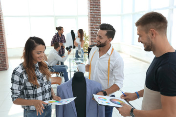tailor and designers discuss the color of men's suit
