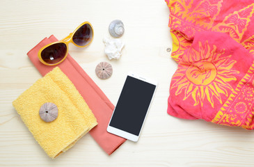 Flat lay image of accessory clothing women to plan travel in holiday, wooden background concept.