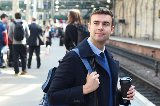 Elegant man about to catch a train