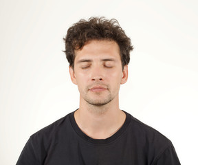 Fototapeta premium Young brunnette man closing his eyes