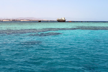 Fototapeta na wymiar Sunken ship in Red Sea near Sharm el Sheikh, Egypt. old vintage shipwreck