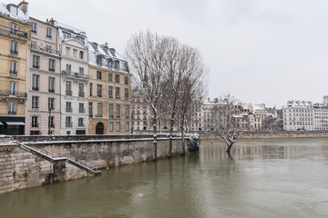 Paris under the snow and floods, flooded quays, typcal staircase, the Seine in winter 