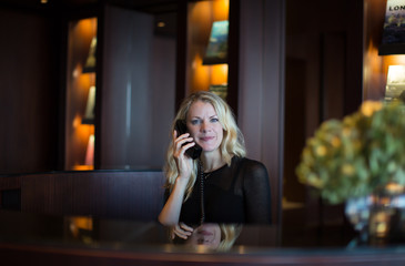 Attractive Woman on the Phone. Sales. Customer Service. Business. Marketing. Nice Setting.