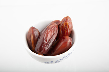 Dates isolated on white background. Food for ramadan