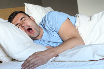 Funny man snoring in bed