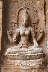 Fototapeta na wymiar Goddess Sarsvati seated on a lotus, northern niche of the central shrine, Brihadisvara Temple, Gangaikondacholapuram, Tamil Nadu