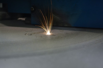3D printer printing metal. Laser sintering machine for metal. Metal is sintered under the action of...